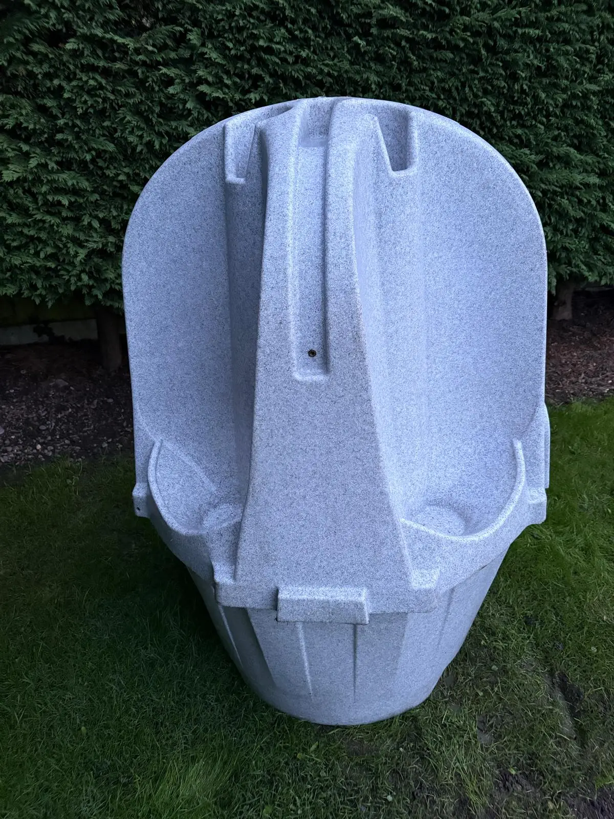 Front-facing view of a grey portable urinal unit with multiple urinals