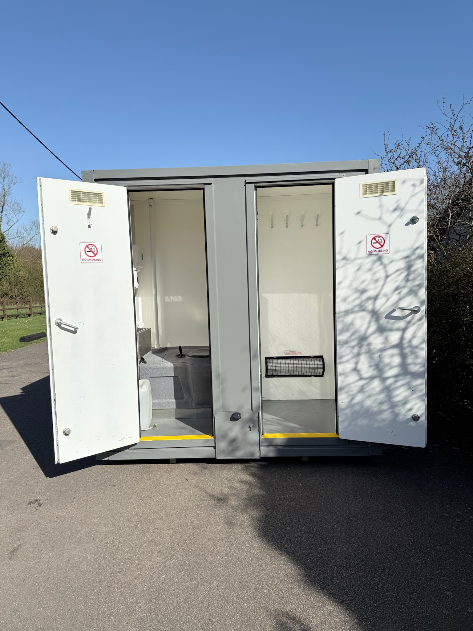 Welfare unit exterior - both toilet compartments with doors open