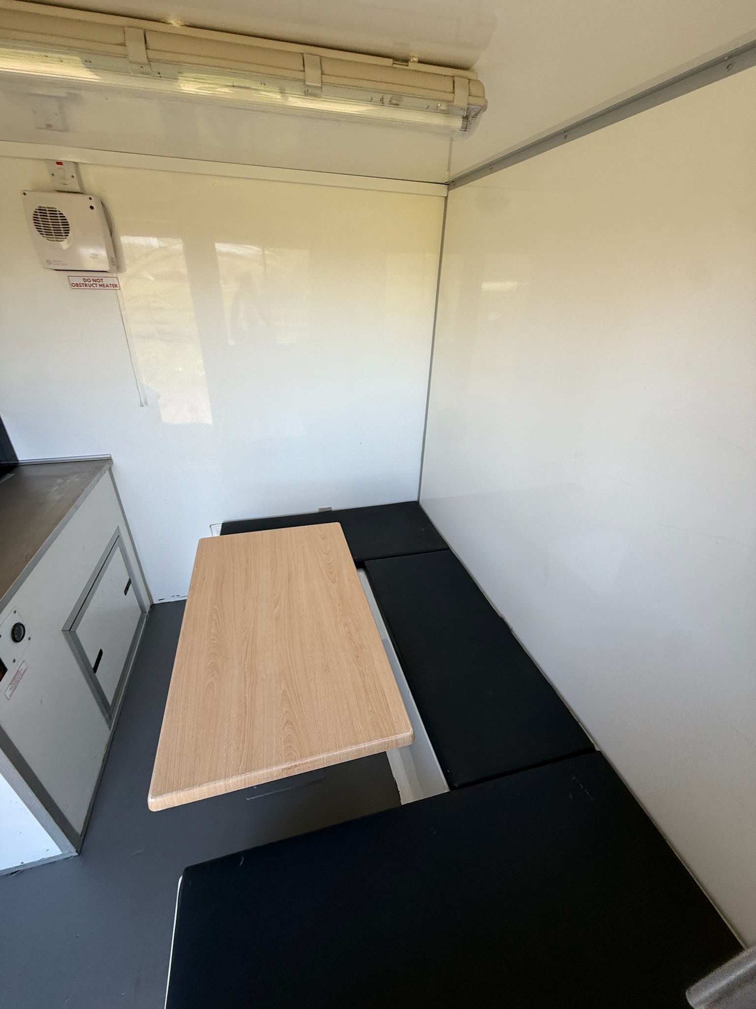 Welfare unit interior - comfortable seating area with table