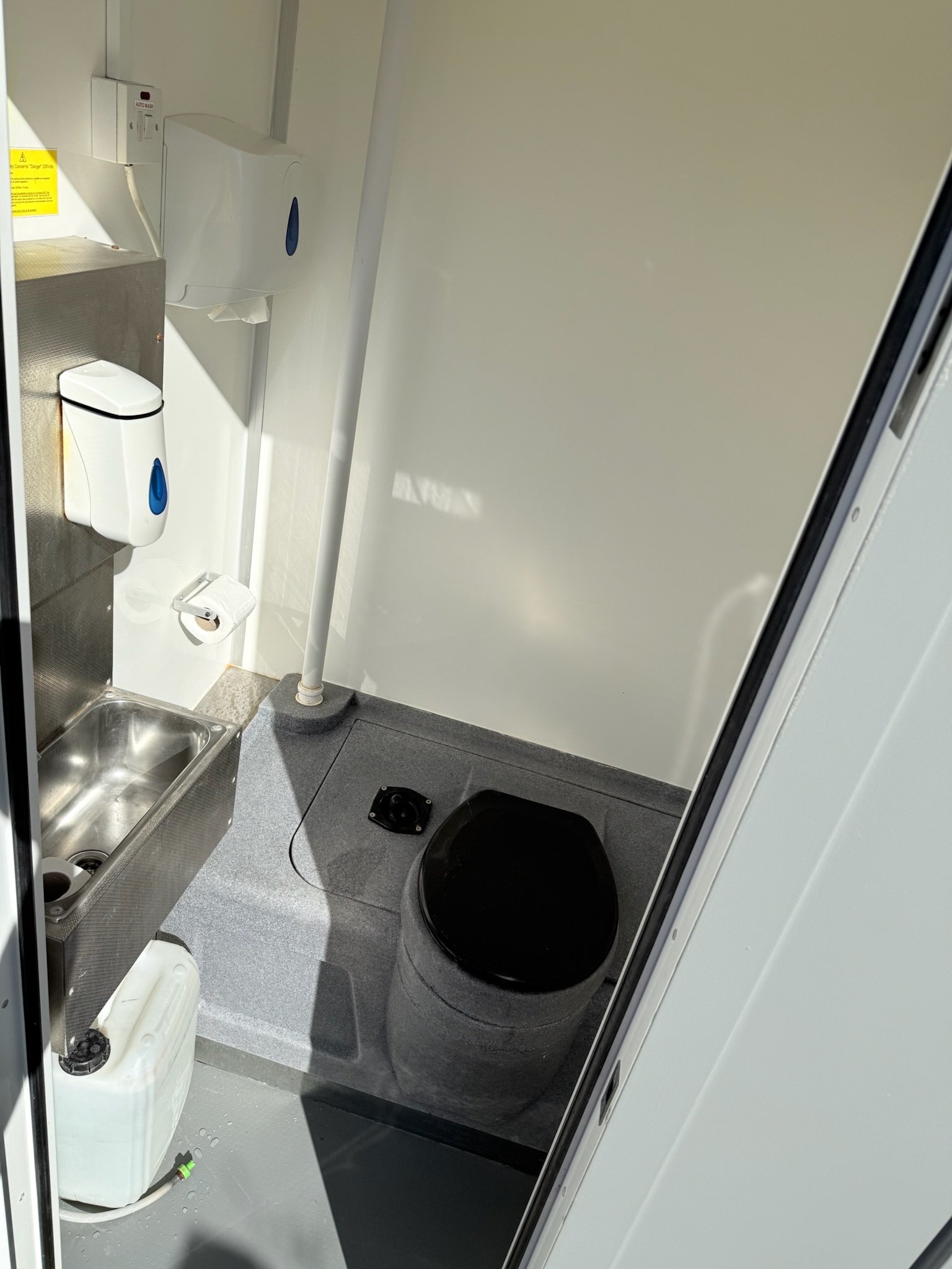 Welfare unit interior - private toilet area with sink and facilities
